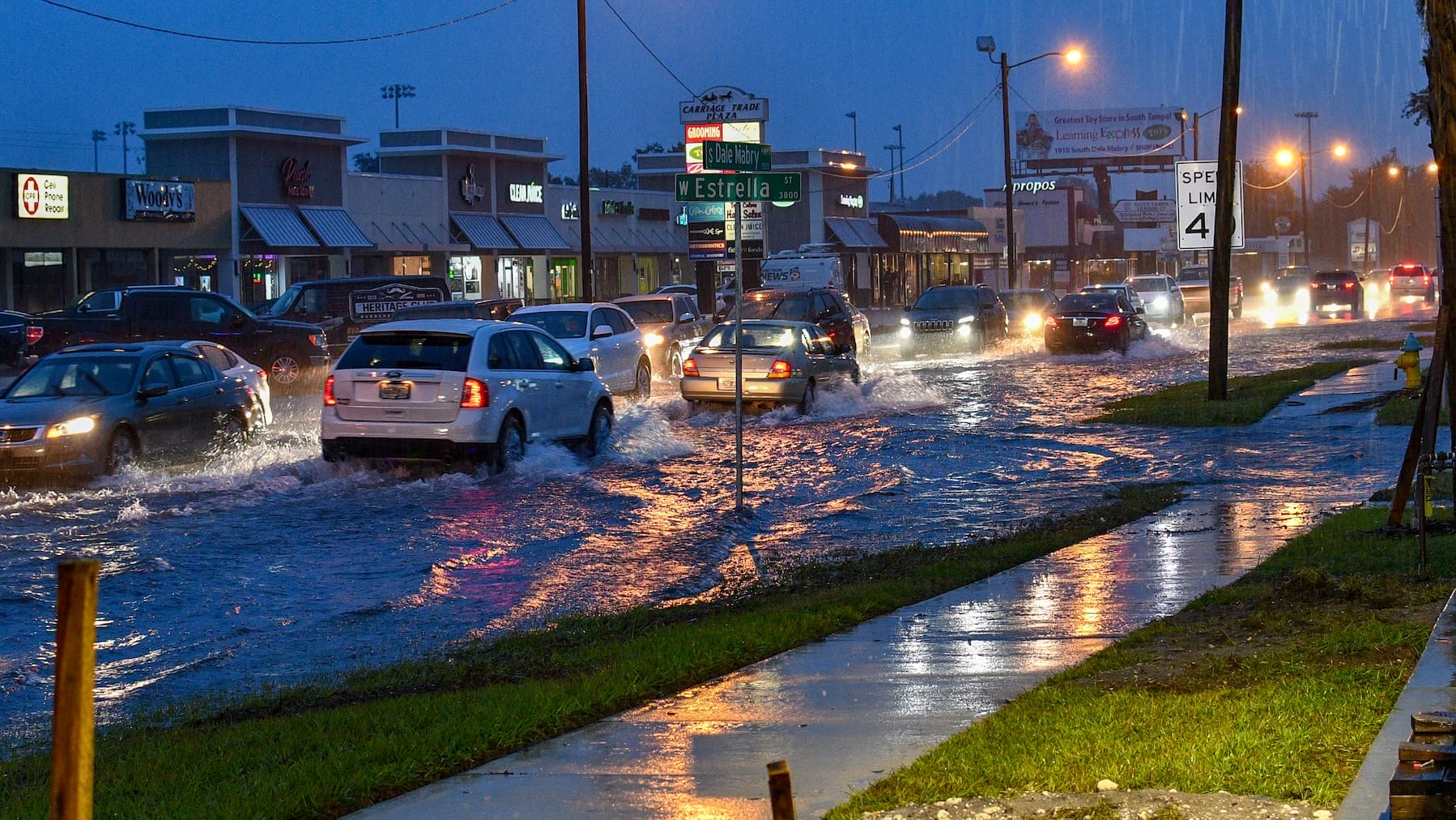 Tampa Florida USA 12-20-2018 heavy rain flooded streets cars going slow thru water